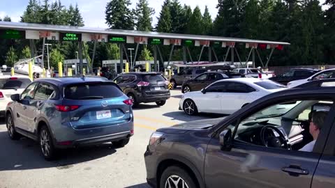 Cars queue up as U.S.-Canada border opens