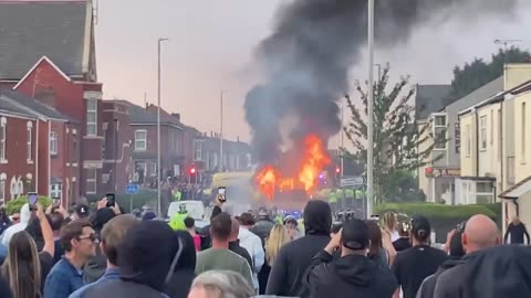 "Chaos in Southport: Police Vans on Fire After Riot Over Brutal Stabbing"