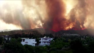 Airborne firefighters target blazing Rhodes hilltop