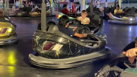 Kids Enjoying Bumper Car .................