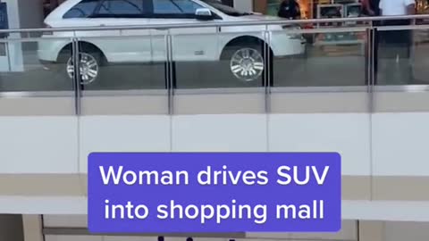 Woman drives SUV into shopping mall