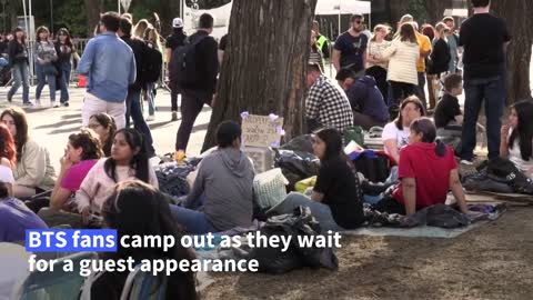 BTS fans camp out to see superstar Jin perform with Coldplay | AFP