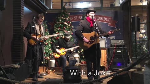 Christmas Tune Band Member Warms Up His Crowd