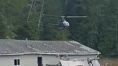 Helicopter Lands Behind Building!