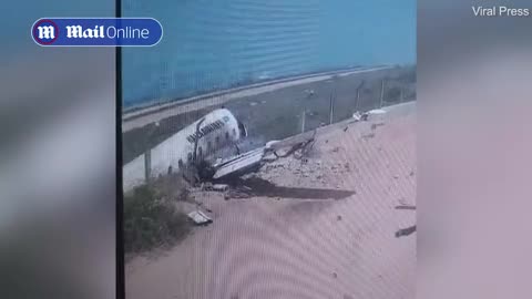 Plane crashes into pieces after skidding off runway in Somalia