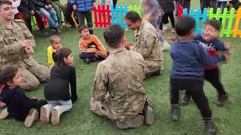 Soldiers Play Tug-Of-War With Children In Affected Areas