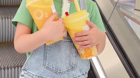 cute baby drinking juice