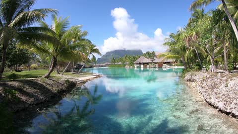 Bora Bora, French Polynesia, Flying Over Beach Resort. 4k Ultra HD