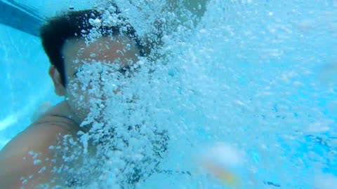 A Man Taking A Selfie In Jumping Into The Pool