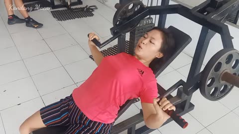 Sarah exercises muscles at fitness centre