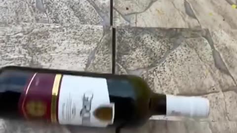 Breaking glass bottle