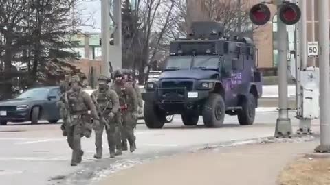2/12/2021 Riot police, SWAT team deployed against Ambassador Bridge protesters in Canada