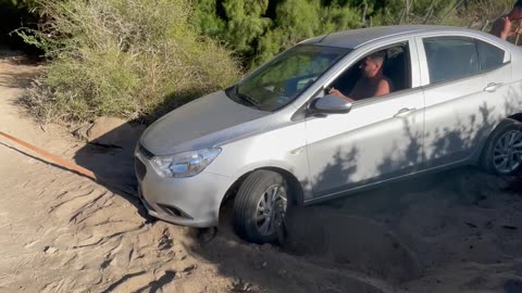 Trying to Tow A Stuck Car By The Bumper