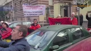 Albania: Kosovo supporters with US, EU flags protest outside Serbian embassy