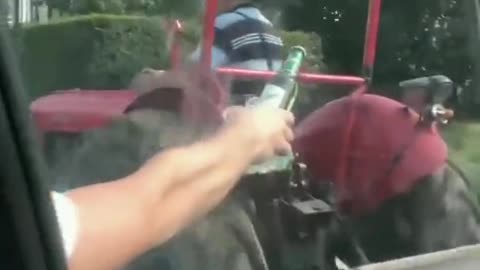 Just some dudes offering a cold one to a farmer on a hot day.