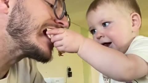 Enjoy this evil baby sharing his quesadilla