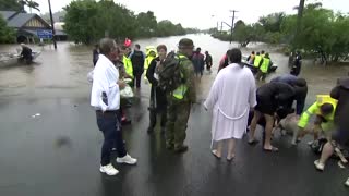 People flee as floods submerge Australian towns