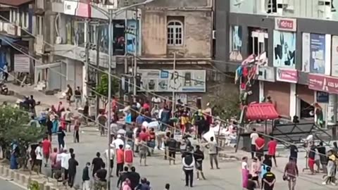 shopping mall being looted in daylight in Imphal, Manipur, India