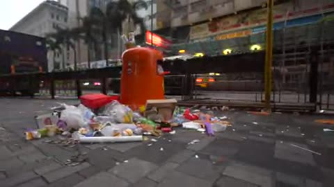 Overflowing Rubbish Bin on Hong Kong Street