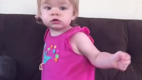 Cute one-year-old dancing baby girl