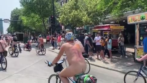 The climate activists in Madison naked in front of kids