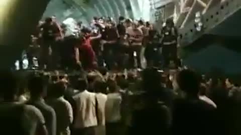 People boarding an evacuation flight at Kabul airport 8-15-2021