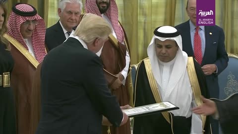 Donald Trump bows and curtsies to Saudi Arabia King Salman as he receives medal