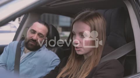 Couple Arguing Heatedly Inside A Car While She Is Driving