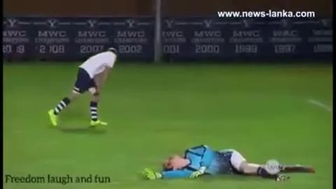 Goalkeeper gets ball in the face.
