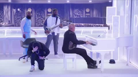 Eminem kneels during Super Bowl 2022 halftime show