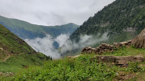 Clouds gathering up on the mountains in Kashmir Pakistan ( heaven on Earth )