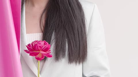 A Young Woman Behind The Pink Curtain