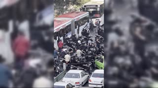 Police clash with protesters in Tehran