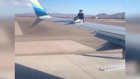 Guy falls off airplane wing in Las Vegas.