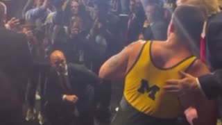 NCAA wrestlers, including champ Patrick Glory, walk over to shake President Trump’s hand