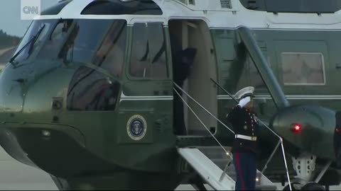 Trump stops to retrieve marine_s hat