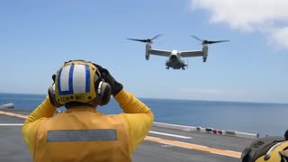 V 22 OSPREY CONDUCT LANDING AND LAUNCING ABOARD THE AIRCRAFT CARRIER