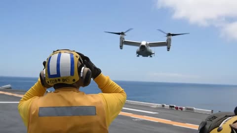 V 22 OSPREY CONDUCT LANDING AND LAUNCING ABOARD THE AIRCRAFT CARRIER
