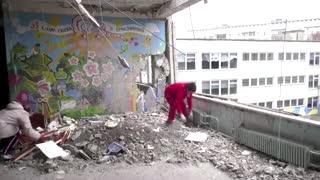 Civilians clear rubble from missile-hit Kharkiv school