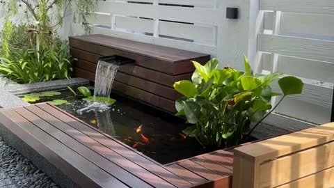 "Shaded Oasis: A Relaxing Patio with a Small Aquarium Touch"