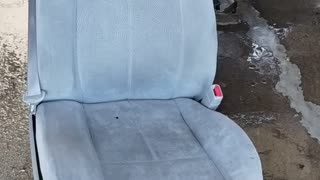 Washing front SUV seat at car wash