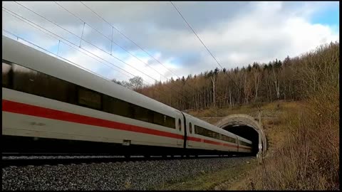 High Speed Train exits/enters tunnel.