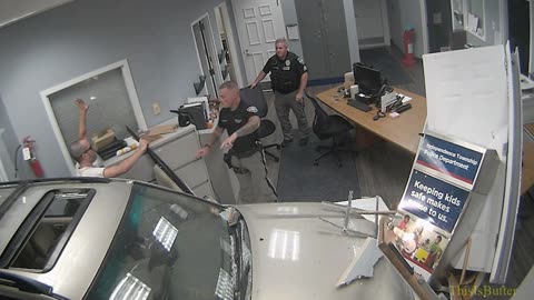 Surveillance video shows man giving himself up after crashing in Warren County police station