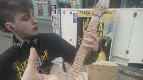 The guy gave a concert with a cardboard guitar