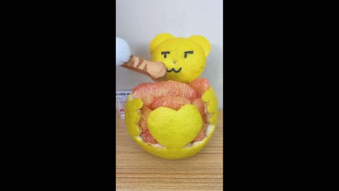 Cute cat making crafts from orange peel