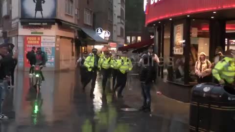 London, UK: Scuffles in Leicester Square, as England and Scotland soccer fans clash with police.