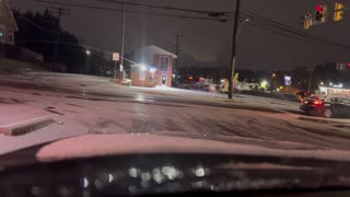 Vehicles Struggle to Stop at Icy Intersection