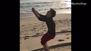 Red shorts backflip fail on beach lands on face
