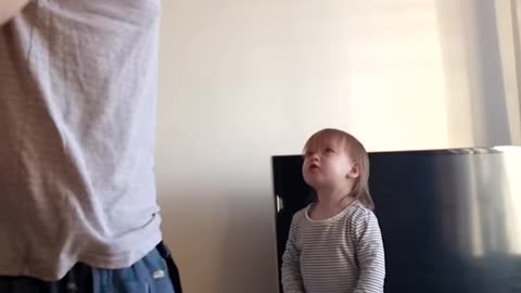 Adorable daddy-daughter standoff