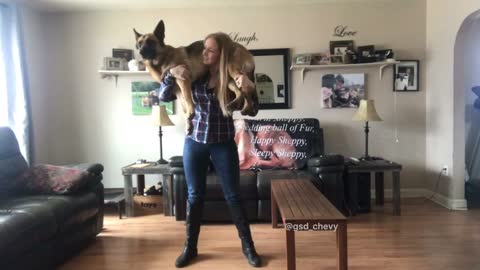 What this woman can do with a 75lb dog on her shoulders will amaze you!